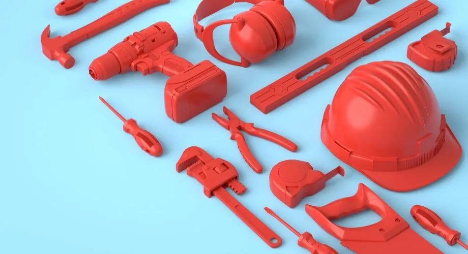 Red tools laid out on a blue background showing construction work and the CPC training package
